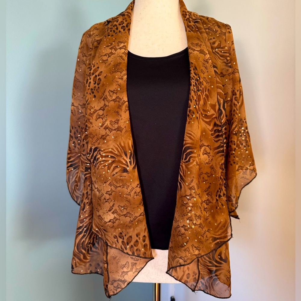 Women’s Sara Michelle Top. Animal print - petite small